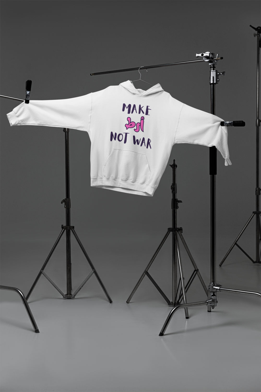White hoodie with 'Make Art Not War' text on a gray background